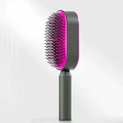 Minimalistische selbstreinigende Haarbürste in Schwaz-pink mit ergonomischem Griff und flexiblen Borsten – modernes Beauty-Tool zum schmerzfreien Entwirren und täglichen Styling für alle Haartypen.